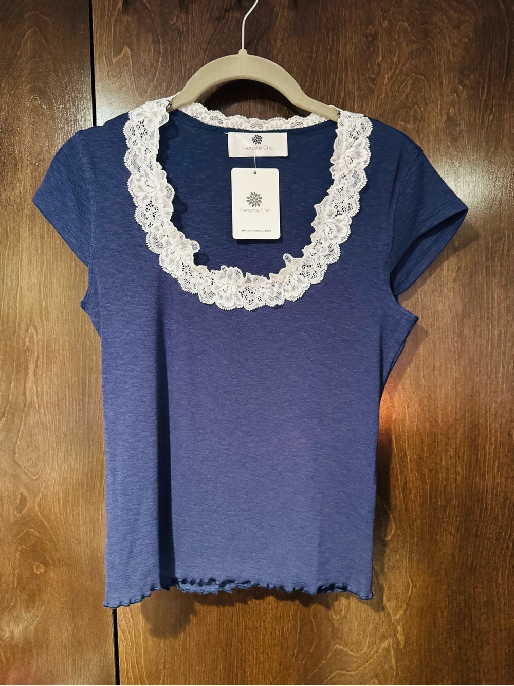 NWT. Navy Lace Trim Top with lettuce hem